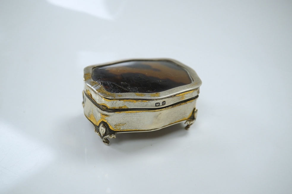 A George V silver and tortoiseshell trinket box, 6.5cm, a planished sterling cigarette case, an early silver wrist watch and sundries. Condition - fair.